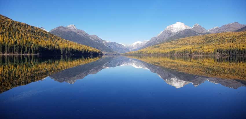 Autumn colors at Bowman Lake. Fall can be spectacular, but early snowfall can shut areas of the park down very suddenly