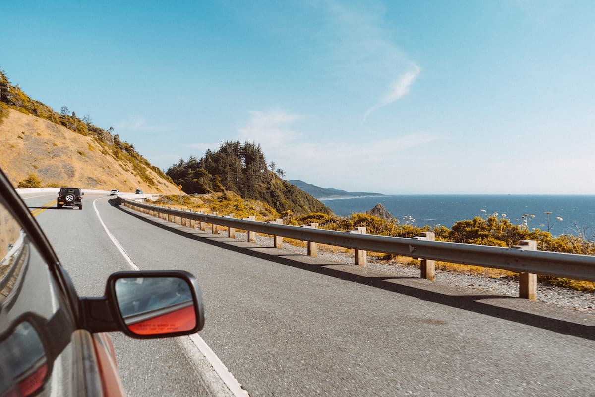 Driving on the road. Photo by Cristofer Maximilian, Unsplash
