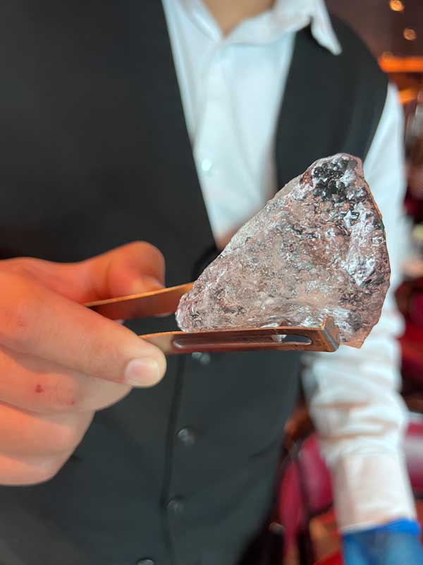 Holding a piece of glacier ice on a Holland America cruise