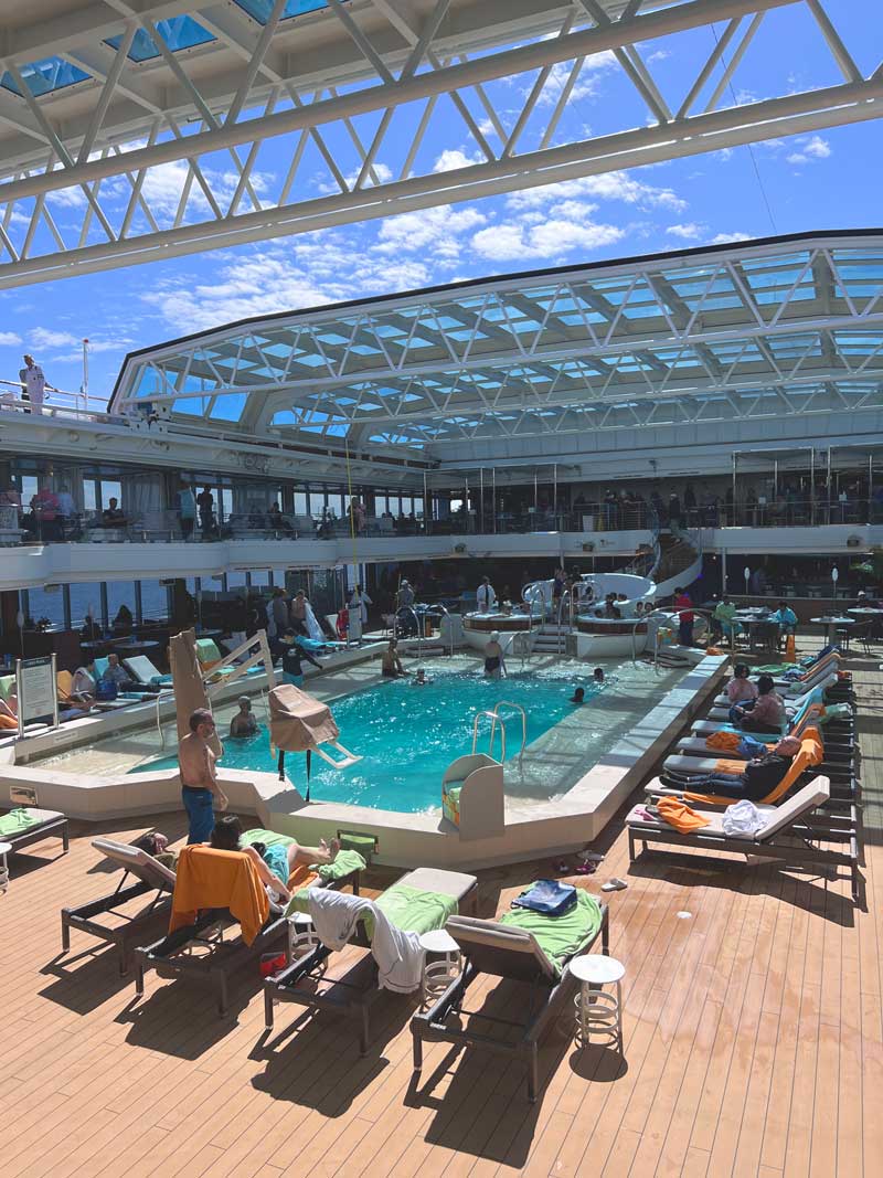 Sunbathing at the ship's pool with an open roof