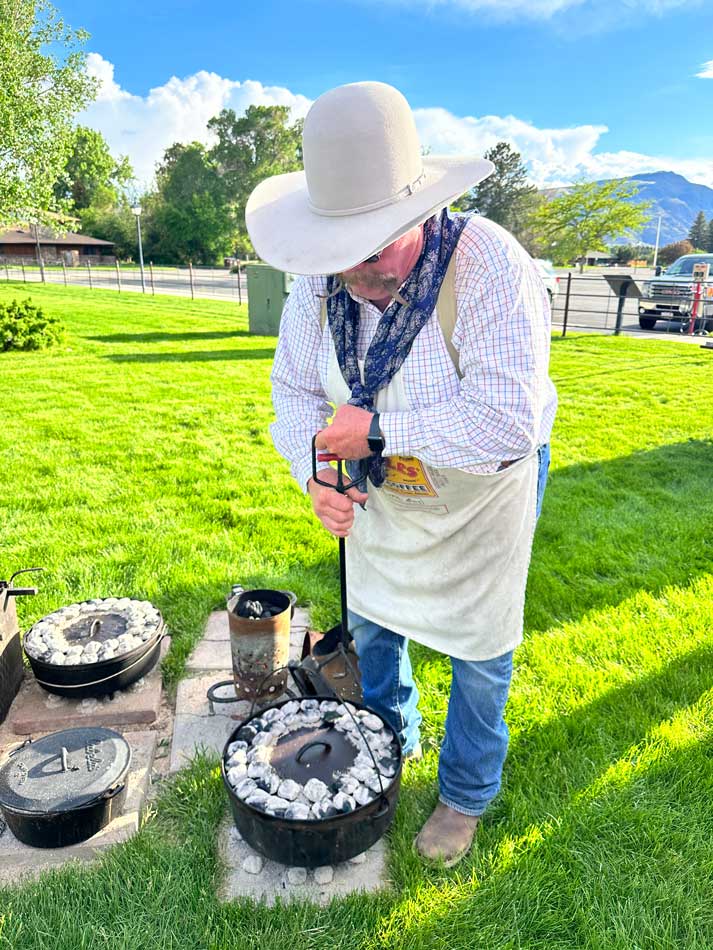 Preparing a meal at the Chuckwagon Cookout. Photo by Janna Graber