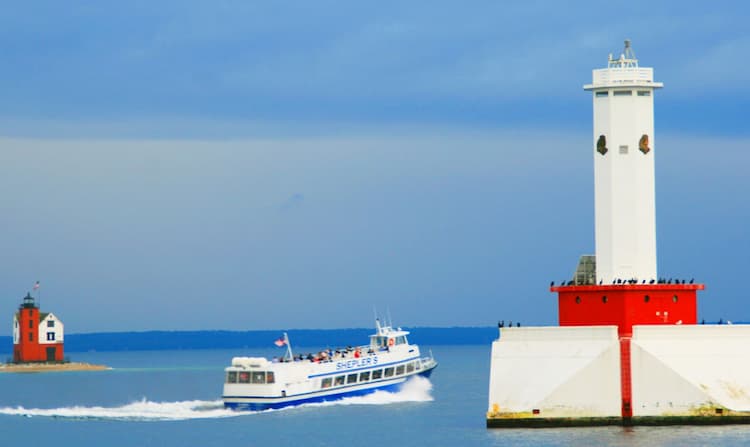 Ferry and lighthouse just offshore of Mackinac Island. Photo by Frank Hosek