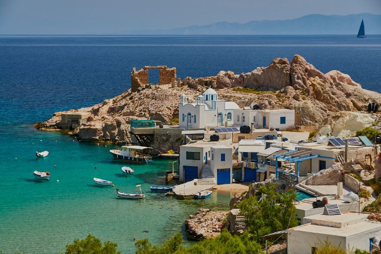 Unique rock formations form a natural harbour on Milos