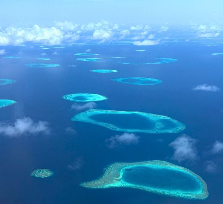 A stunning view of the scattered islands in the Indian Ocean taken from a plane. Photo by Pooja Amritkar