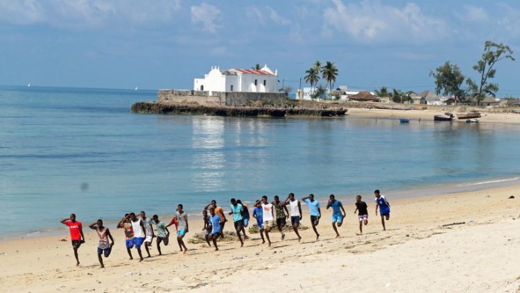 Boys exercising on the beach