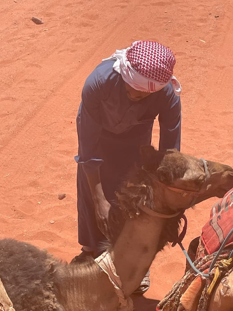 Hassan tends the camels. Photo by Brian Patrick Bolger