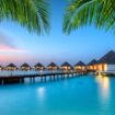 Staying in an overwater bungalow is a bucket-list item in the Maldives. Image by jakubgojda via Canva