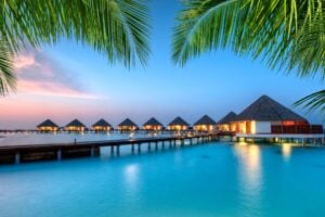 Staying in an overwater bungalow is a bucket-list item in the Maldives. Image by jakubgojda via Canva