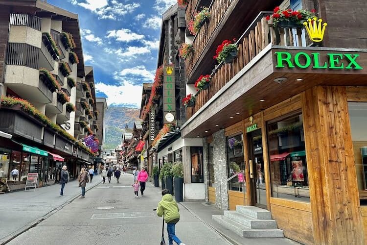 The Bahnhofstrasse, Zermatt's main shopping street, is flanked by stores selling luxury goods and outdoor gear. Photo by Amy Laughinghouse
