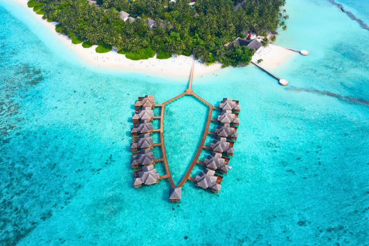 The beautiful turquoise clear waters of the Maldives. Photo by swisshippo from Getty Images via Canva