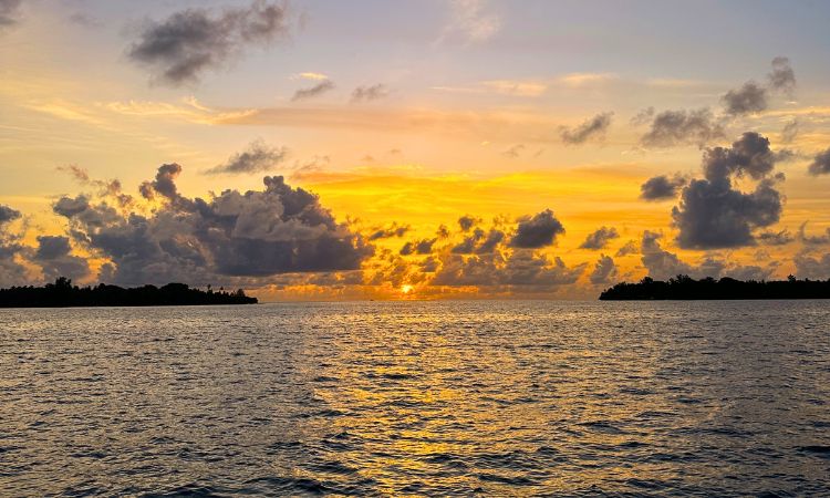 Witnessing the most beautiful setting sun in the middle of two islands. Photo by Pooja Amritkar.
