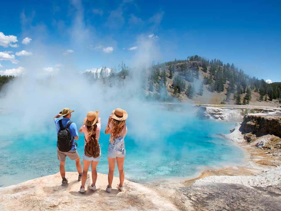 Travelers at Yellowstone National Park. Photo by iStock