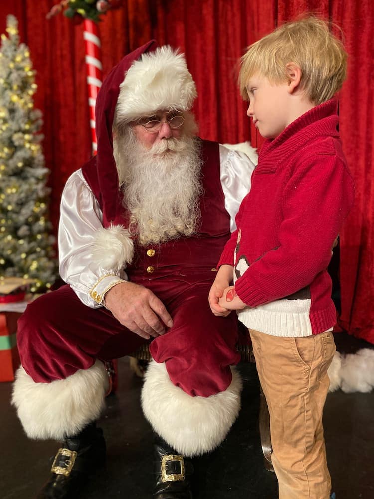 Boy with Santa. Photo by Carri Wilbanks