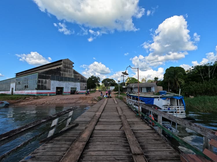 Stepping off the lancha in Fordlândia. Photo by Charles Ferguson