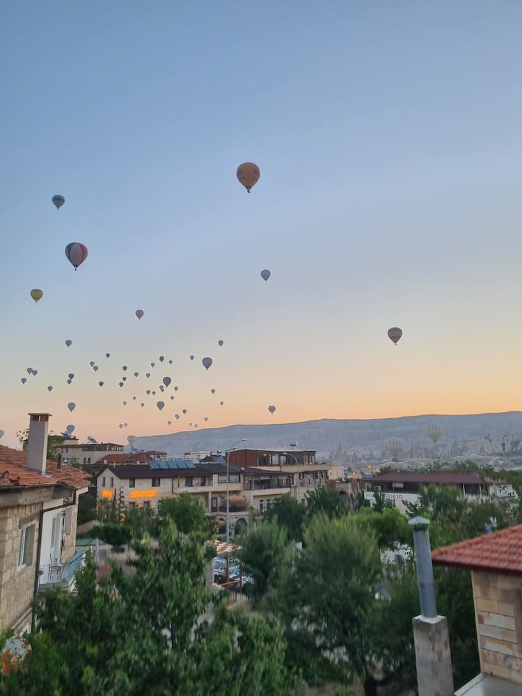 The hot air balloons from a terrace in Göreme. Photo by Lucy Arundell 