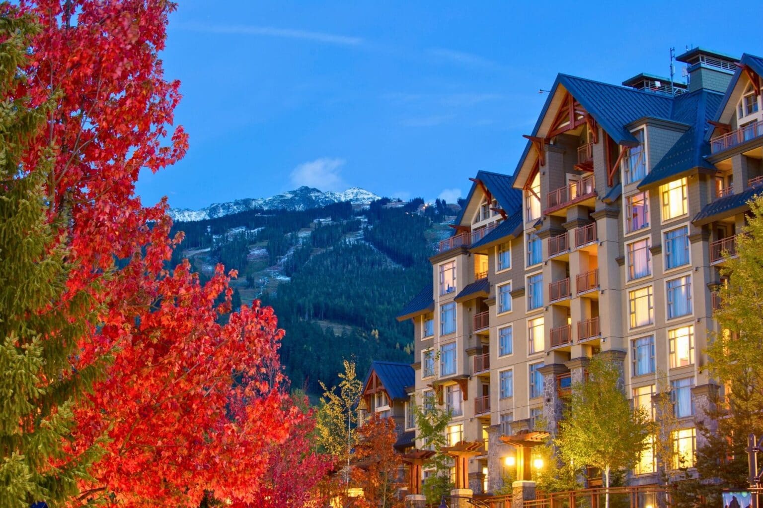 Whistler, British Columbia, framed by vibrant fall foliage. Photo by stockstudioX from Getty Images Signature via Canva