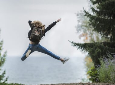 Woman jumping with backpack. Photo by Pexels, Pixabay