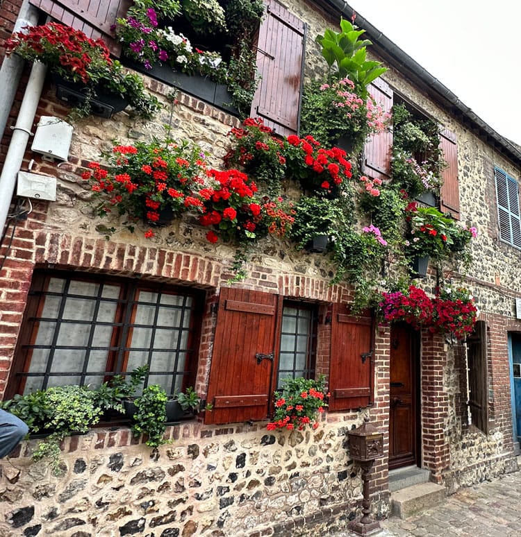 Flower covered building in Honfleur, France. 