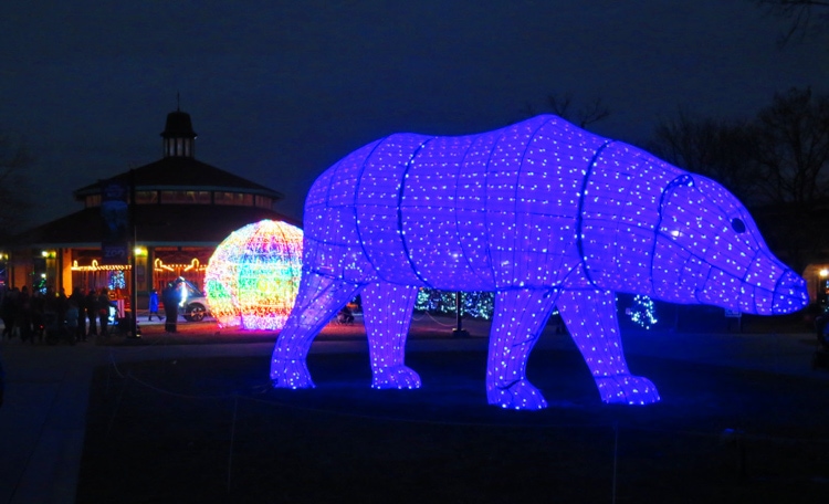A larger-than-life polar bear sculpture that change colors intermittently