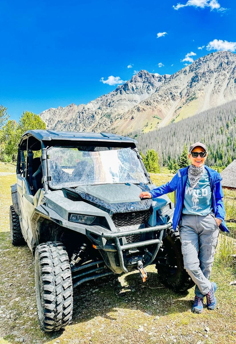 Author standing next to side-by-side four-wheel vehicle at Kirwin Ghost Town.