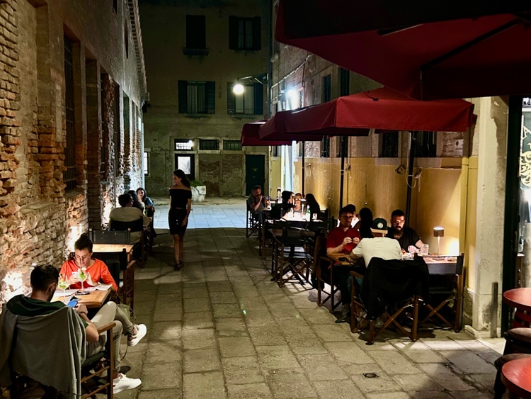 Diners linger outside Corte Loredana at night