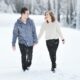Couple walking on snow. Photo by Yuriy Bogdanov, Unsplash