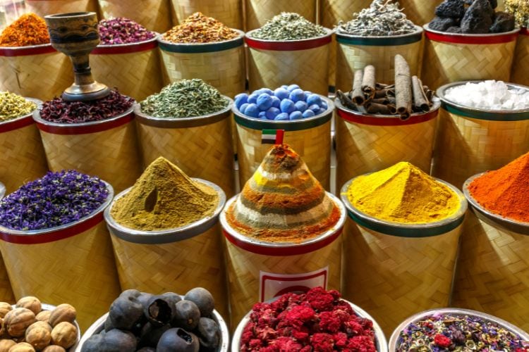 Colorful spices at a souk in Morocco. Photo by Canva