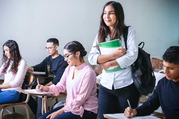 Student in class. Photo by javier trueba on Unsplash