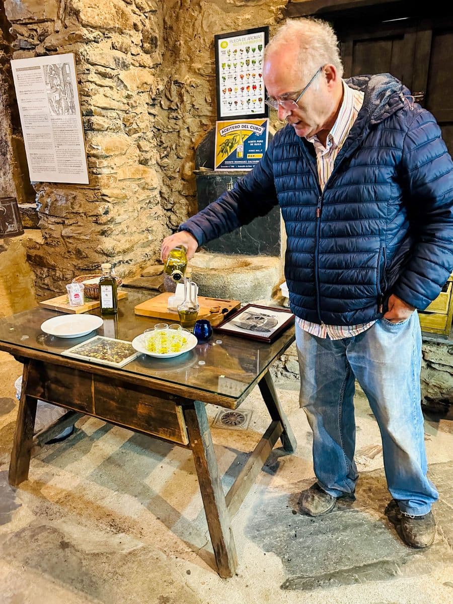 Julio, a retired physician, gives tours of the Olive Oil Museum