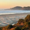 The sun begins to set on Agate Beach. Photo by Debbie Stone