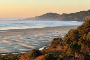 The sun begins to set on Agate Beach. Photo by Debbie Stone
