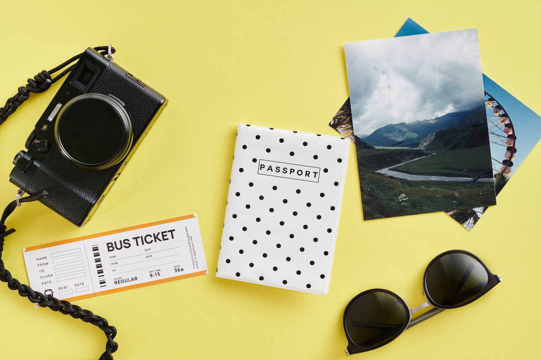 Traveling with a passport photo, bus ticket , and camera. Photo by Unsplash Plus and Andrej Lisakov
