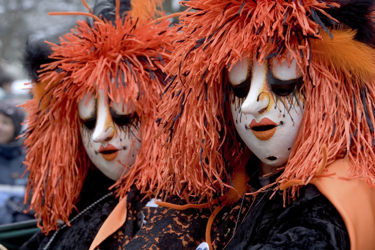 Performers wearing traditional masks at Basel Fasnacht. Photo by Canva