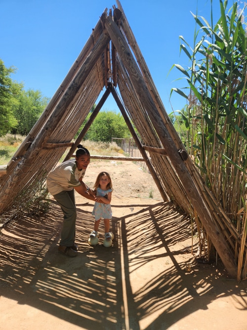 Standing on ostrich eggs at the Safari Ostrich Farm in Oudtshoorn