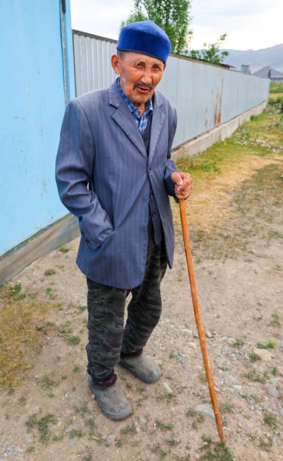 Elderly gentleman in Saty, Kazakhstan, poses for a photo.