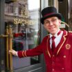 Doorman welcomes guests to Hotel Sacher, Vienna.