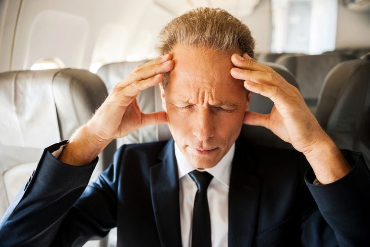 Man holding head in pain