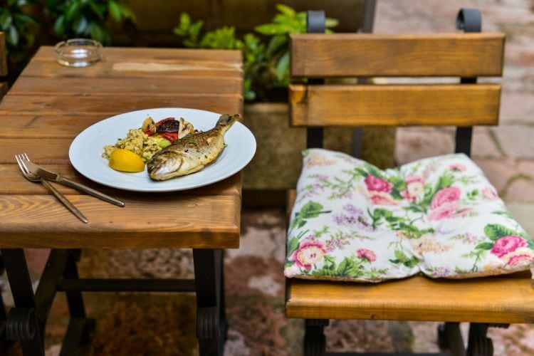 Enjoy fresh fish at a local restaurant