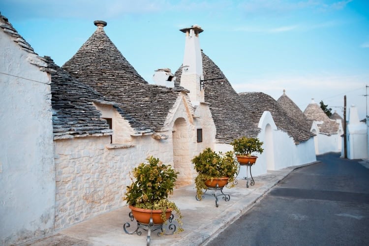 Traditional trulli houses in Alberobello, Italy. Photo by Levranii from Getty Images via Canva