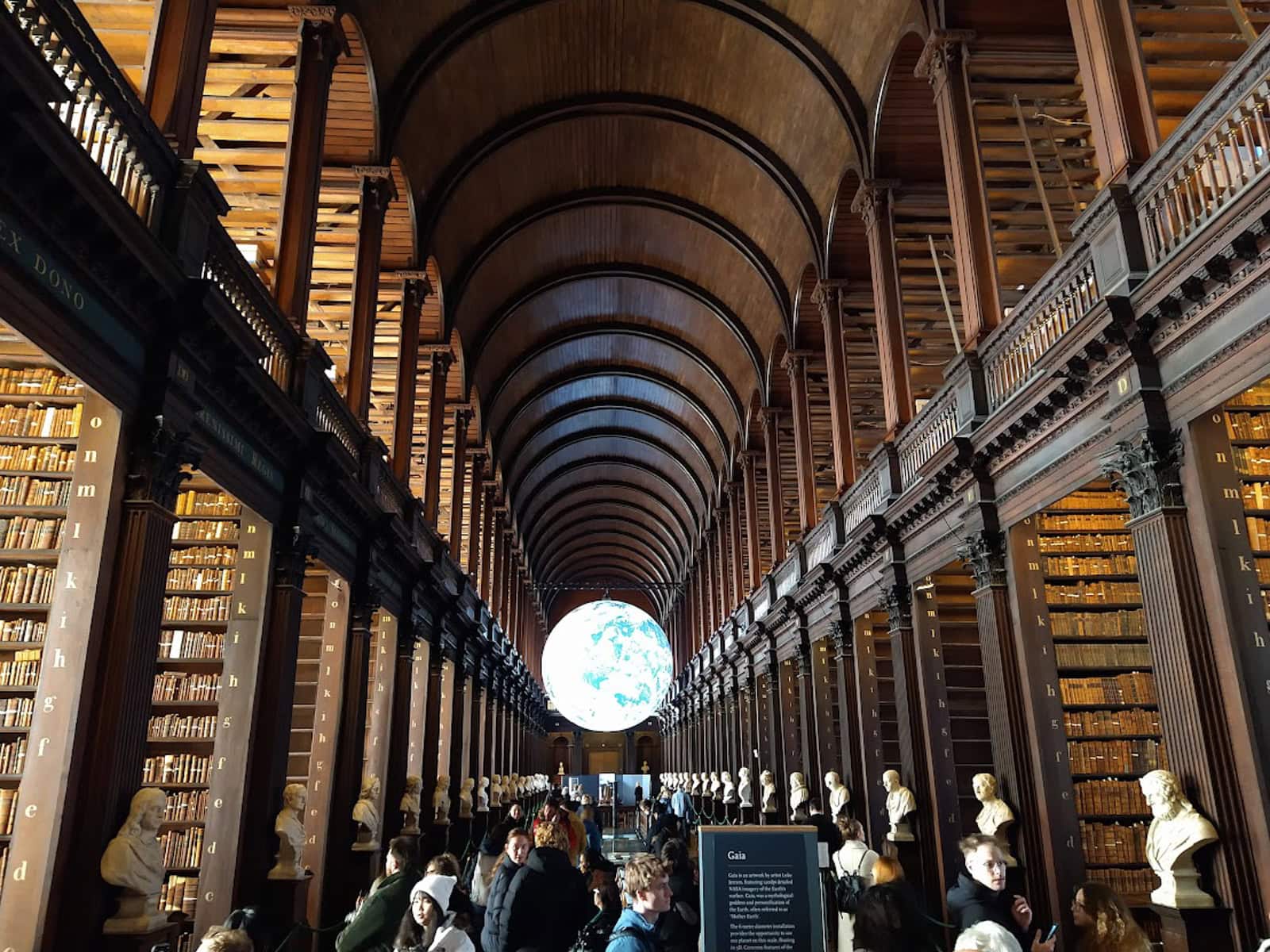 The real Long Room Library at Trinity College, wiht the Gaia Installation (a hovering globe) in the distance