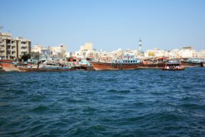 Merchant boats at Dubai Creek, Dubai, United Arab Emirates. Photo by Saj Shafique, Unsplash