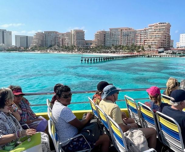 blue and yellow UltraMar Ferry Boat to Isla Mujeres