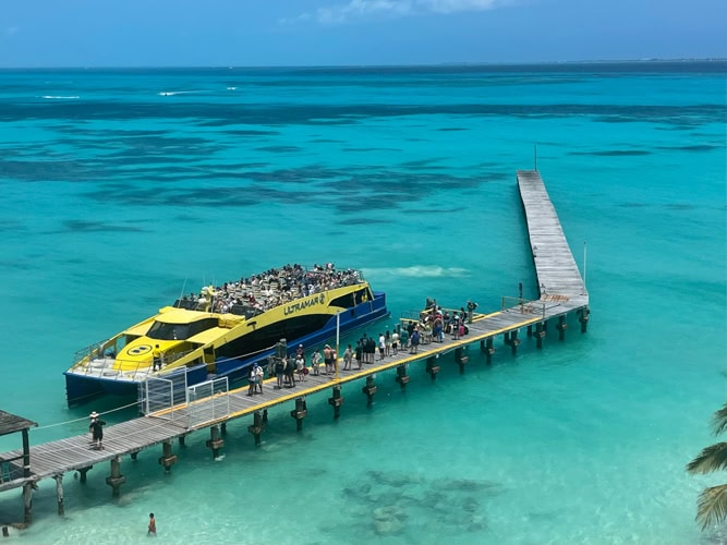 The Ultramar Ferry dock is right below Grand Fiesta Americana Coral Beach Resort