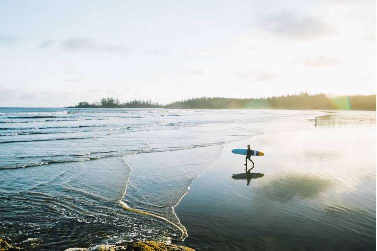 Surfer in Tofino. Photo courtesy of Destination BC, photographer Ben Giesbrecht