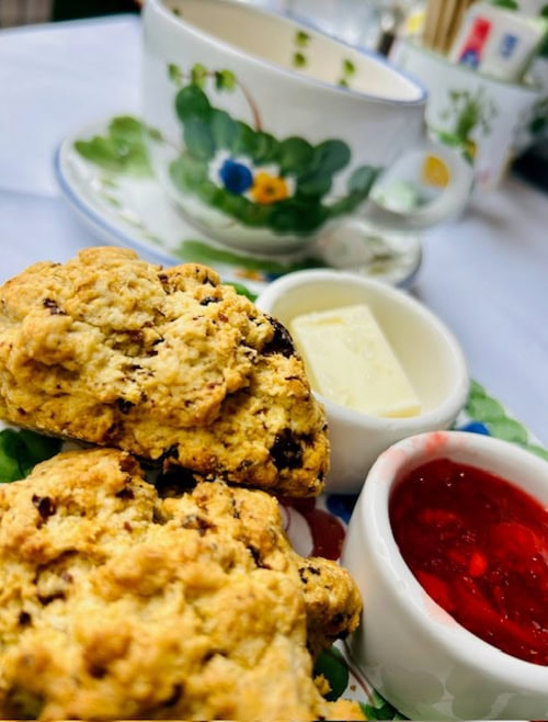 Cappuccino, scones, butter and jam