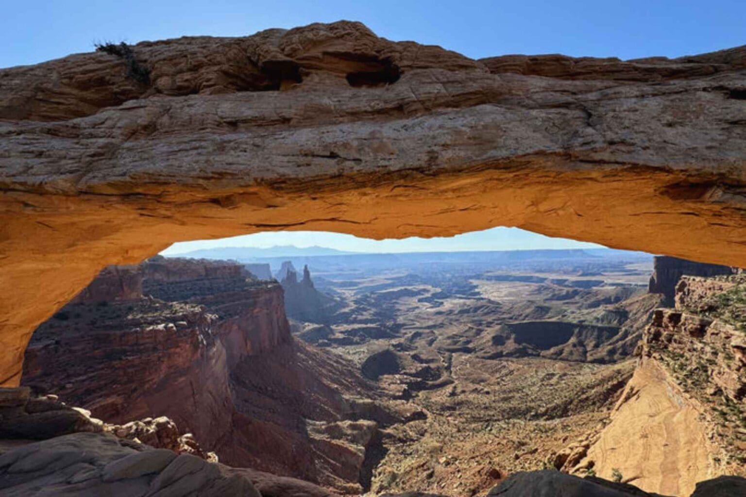 Before or after your raft trip do some hiking in Canyonlands National Park and check out Mesa Arch. Photo by Debbie Stone