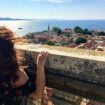 Taking in Zadar's rooftops and the Adriatic from the Bell Tower of St. Anastasia's Cathedral. Image by Chris Babcock from Getty Images via Canva