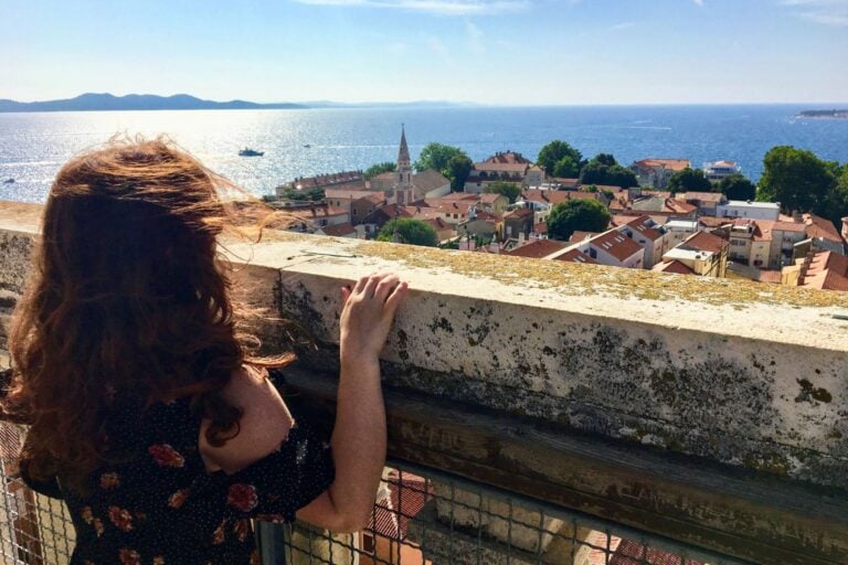 Taking in Zadar's rooftops and the Adriatic from the Bell Tower of St. Anastasia's Cathedral. Image by Chris Babcock from Getty Images via Canva