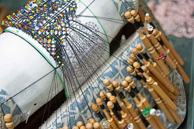 Colorful pins are used to hold threads in place on the pattern. Photo by Rebecca L. Rhoades
