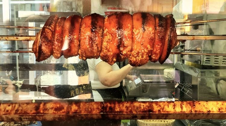 Porcheddu, suckling pig cooked on a rotisserie, is a Sardinian specialty. Photo by Edward Placidi